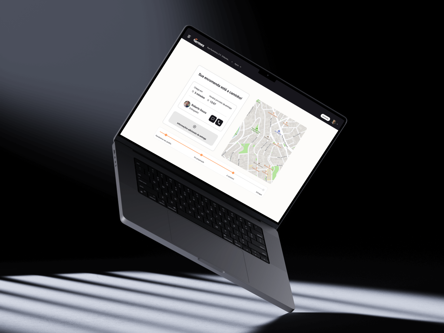 White Mediterranean-style house with a terracotta roof, surrounded by lush greenery and partially obscured by vibrant red-orange flowers in the foreground